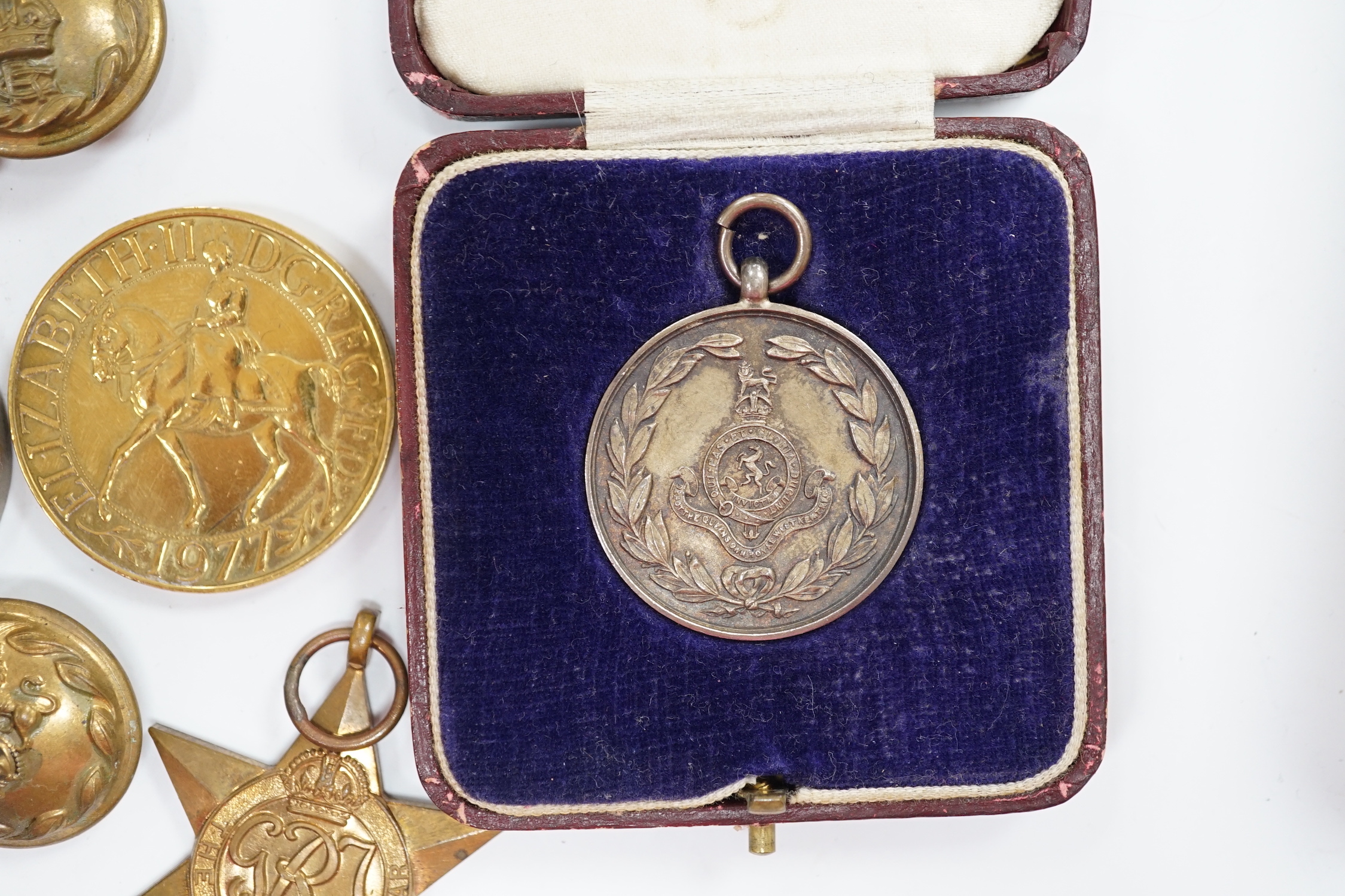 A collection of medals and coins including; an original card Air Ministry box containing a 1939-45 star and a 1939-45 medal in their greaseproof envelopes, together with a further Defence medal, a 1939-45 medal, a cased